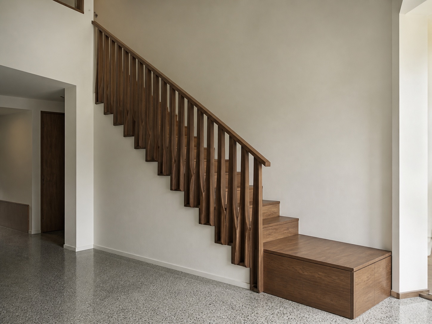 Walnut sectional stair rail in a daylight interior